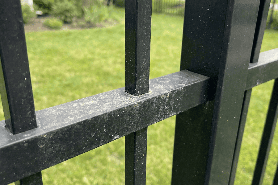 close up of dirty black fence