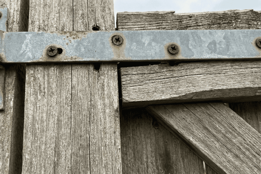 close-up of old gate and hinges