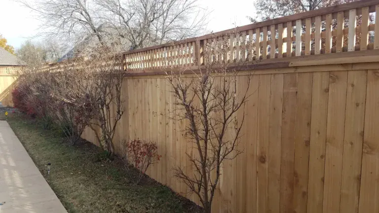 Cedar privacy fence with lattice topper along a side yard, built by Tiller Fence and Deck in the Oklahoma City metro